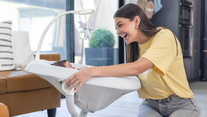 Shape the Future mom with baby in swing
